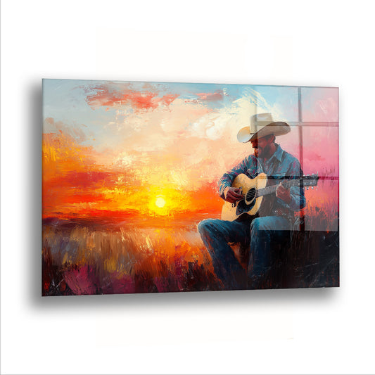 Gitar Çalan Adam cam tablo — Güneş batarken gitarını kucağına almış bir adam ve kimsenin duymadığı bir şarkı.